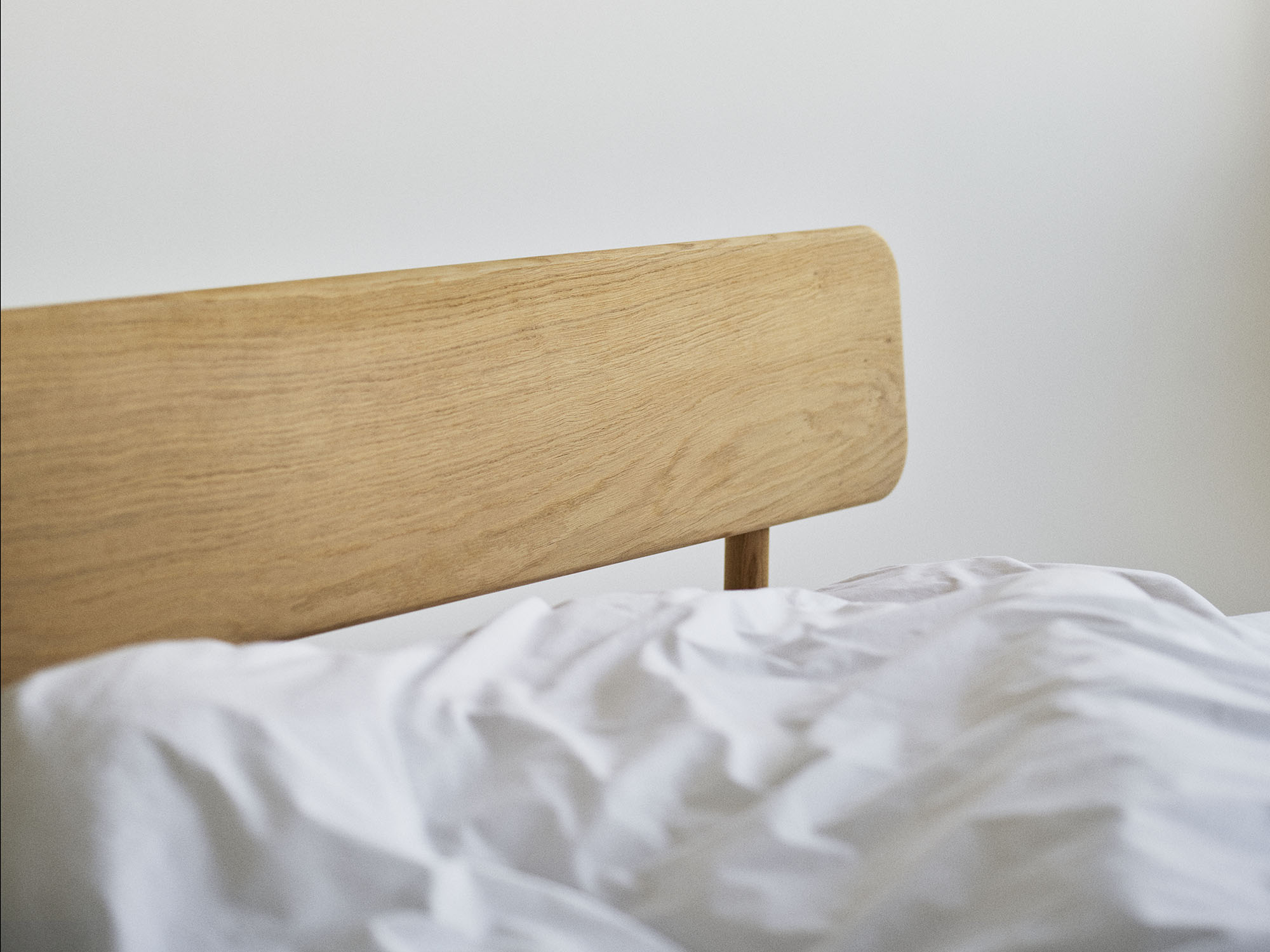 RYE Alken bed frame in oiled solid oak - headboard detailed pack shot