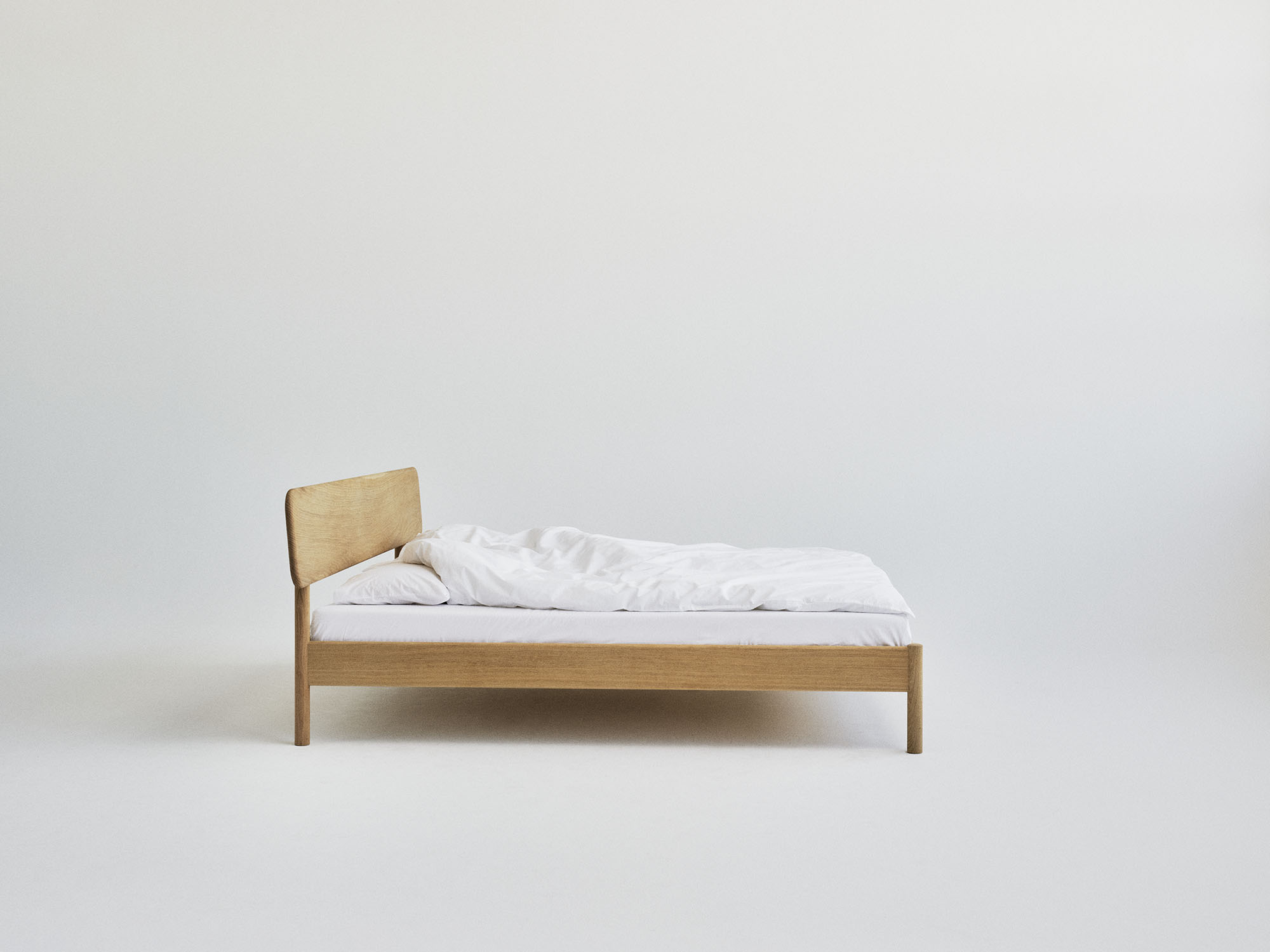 RYE Alken bed frame in oiled solid oak - side view pack shot