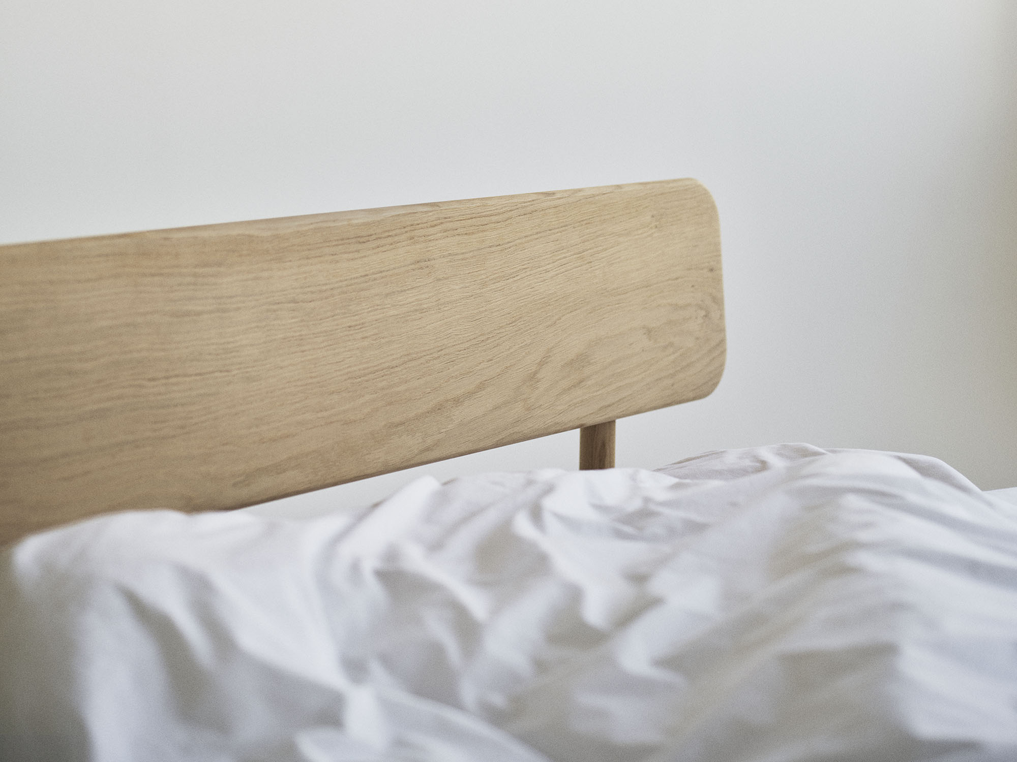 RYE Alken bed frame in soaped solid oak - headboard detailed pack shot